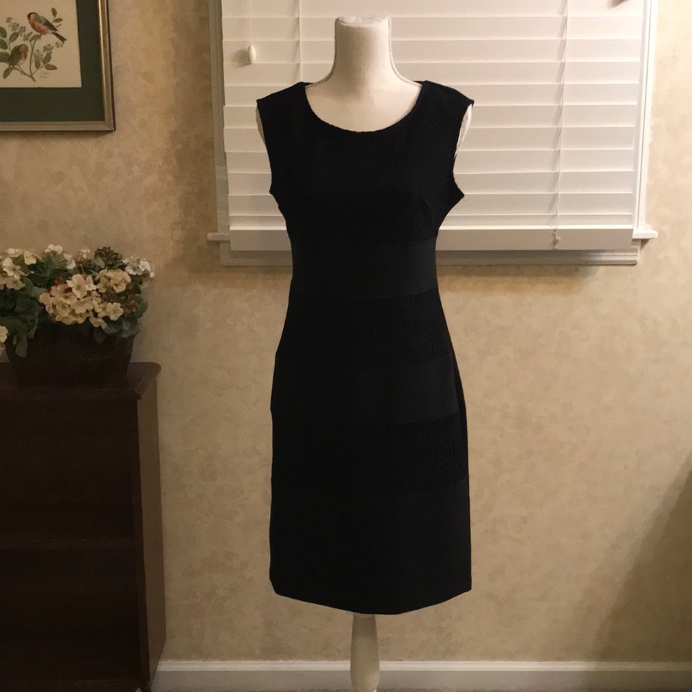 Sleeveless black dress with lace detail